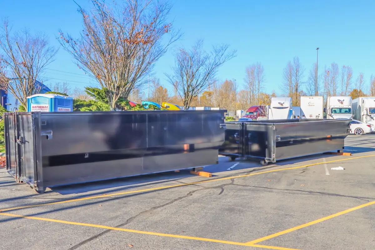 Professional dumpster rental service with roll-off container on residential driveway in Villa Park